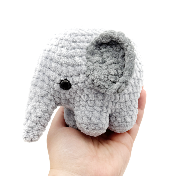 Crochet Amigurumi Elephants in gray being held in hand