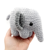Crochet Amigurumi Elephants in gray being held in hand