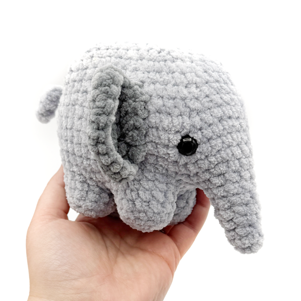 Crochet Amigurumi Elephants in gray being held in hand