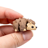 3D printed mini hedgehog fidget creature held in hand