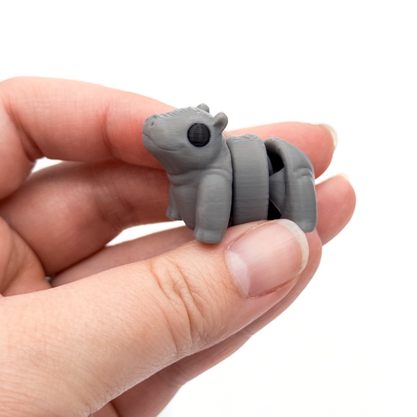 3D printed mini hippo fidget creature held in hand
