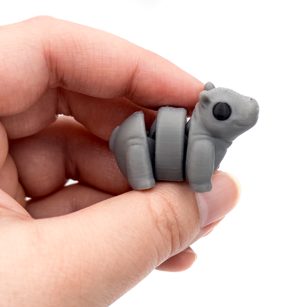 3D printed mini hippo fidget creature held in hand