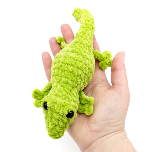 Crochet Amigurumi Lizard in Pistachio laying in hand