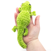 Crochet Amigurumi Lizard in Pistachio sitting in hand