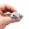 3D printed mini manatee fidget creature held in hand