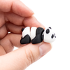 3D printed mini panda fidget creature held in hand
