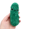 Crochet Amigurumi Pickle in Emerald held in hand
