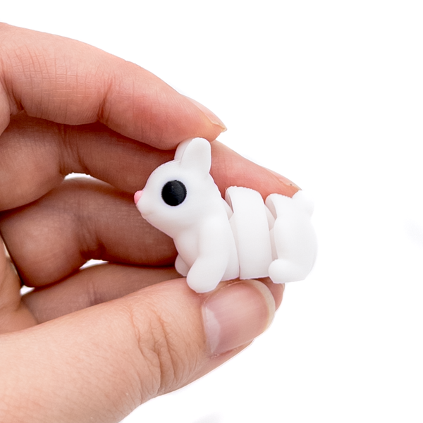 3D printed mini rabbit fidget creature held in hand