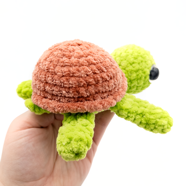 Sea Turtle Crochet Amigurumi Stuffed Animal being held in hand showing little tail