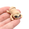 3D printed mini sloth fidget creature held in hand