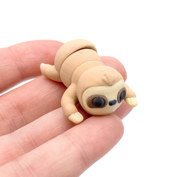 3D printed mini sloth fidget creature held in hand