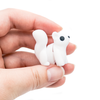 3D printed mini white squirrel fidget creature held in hand