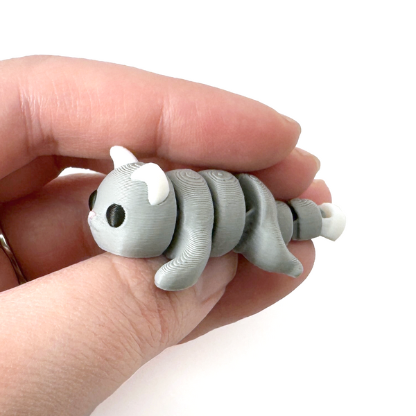 3D printed cat mini fidget creature being held