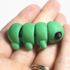 3D printed caterpillar mini fidget held in hand