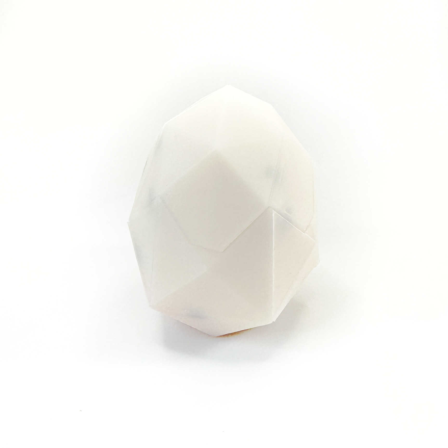 3D printed chick and egg puzzle fully assembled, chick is inside fully put together egg.