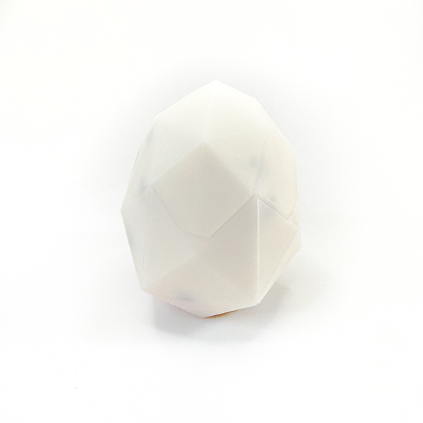 3D printed chick and egg puzzle fully assembled, chick is inside fully put together egg.