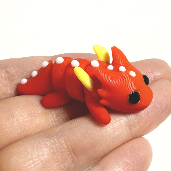 3D printed dragon with wings mini fidget creature held in hand