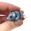 3D printed grey mouse fidget creature held in hand