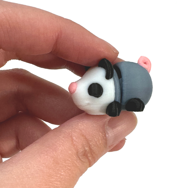 3D printed mini opossum fidget creature held in hand