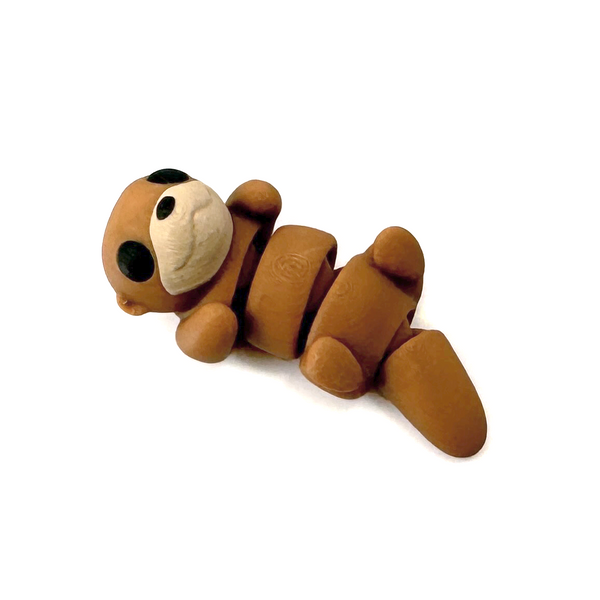 3D printed otter mini fidget creature that is belly up and laying on its back