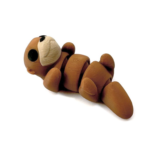 3D printed otter mini fidget creature that is belly up and laying on its back