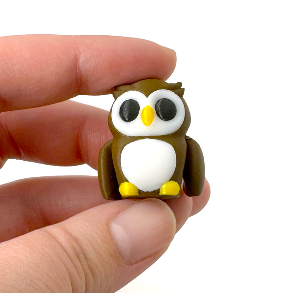 3D printed owl mini fidget creature being held