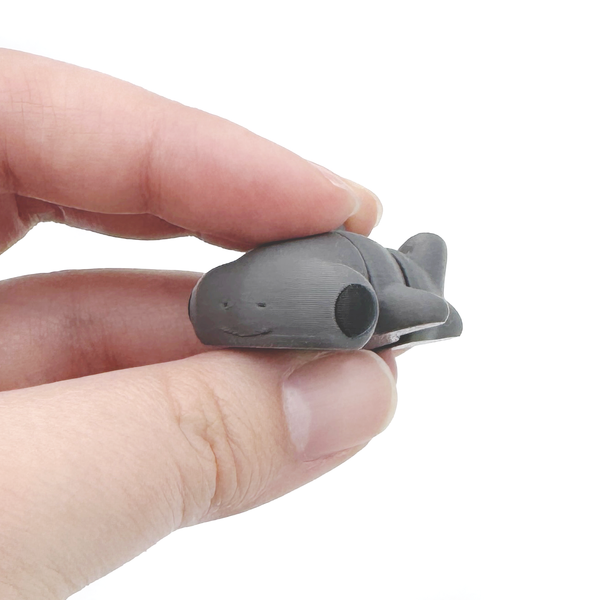 3D printed mini hammerhead shark fidget creature held in hand