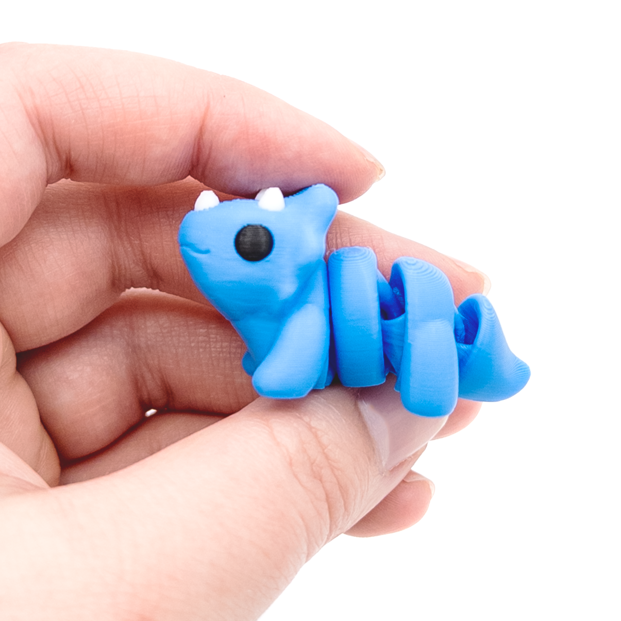 3D printed triceratops dinosaur mini fidget creature being held