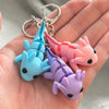 3D printed axolotl mini fidget creature keychains being held