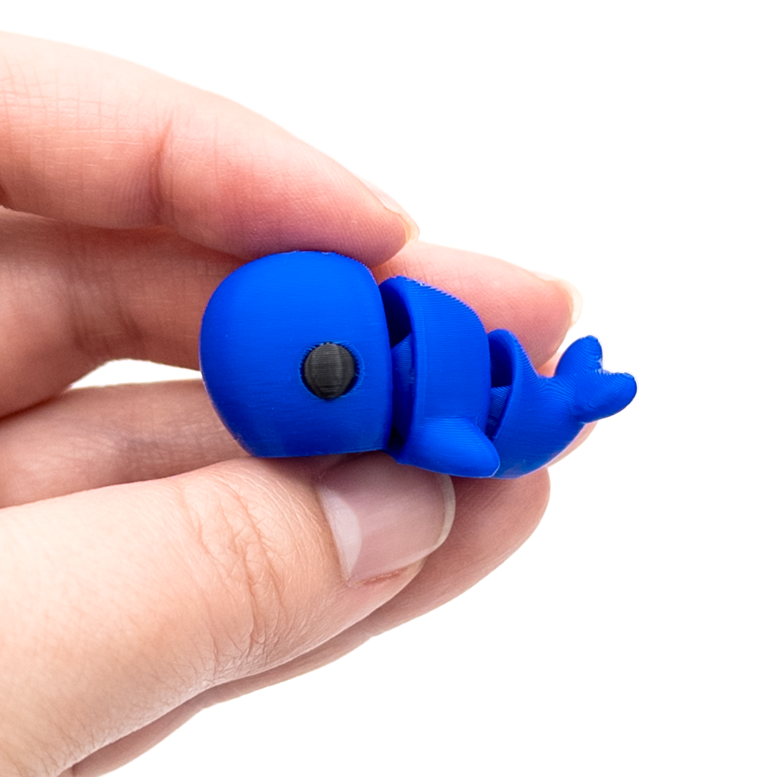 3D printed mini whale fidget creature held in hand