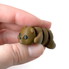 3D printed bear mini fidget creature being held