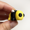 3D printed bee mini fidget creature being held