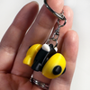 3D printed bee mini fidget creature keychain being held