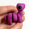 3D printed brontosaurus dinosaur mini fidget creature being held