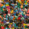 overhead view of bulk mixed pile of mini fidget creatures