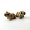 Two 3D printed capybara mini fidget creatures, one with an orange on its head and one without