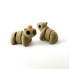 Two 3D printed capybara mini fidget creatures, one with an orange on its head and one without