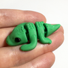 3D printed crocodile/alligator mini fidget creature being held