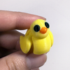 3D printed duck mini fidget creature being held