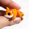 3D printed fox mini fidget creature being held