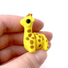 3D printed giraffe mini fidget creature being held