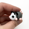 3D printed opossum with pink feet mini fidget creature being held