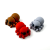 Three 3D printed spider mini fidget creatures - one in brown, one in red, and one in light gray